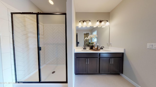 full bathroom with a sink, double vanity, and a shower stall