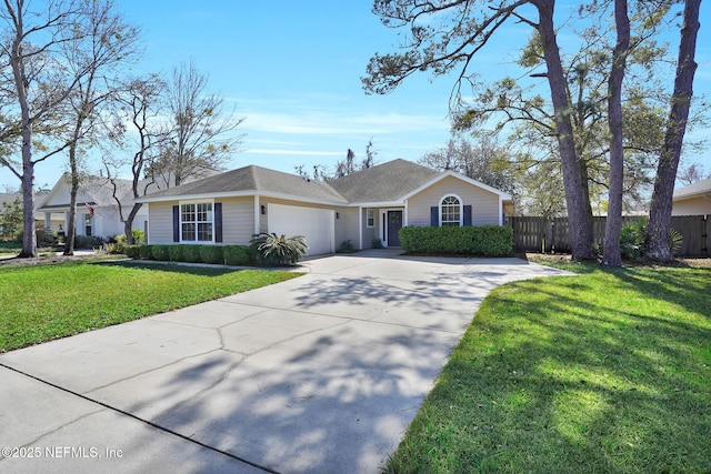 774 Barrington Dr, Fernandina Beach, FL 32034 - ranch-style home featuring an attached garage, fence, a front yard, and concrete driveway