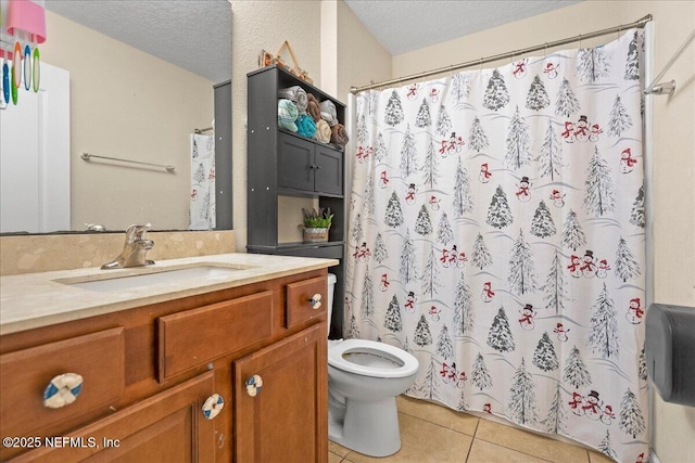 bathroom with toilet, tile patterned floors, curtained shower, a textured ceiling, and vanity