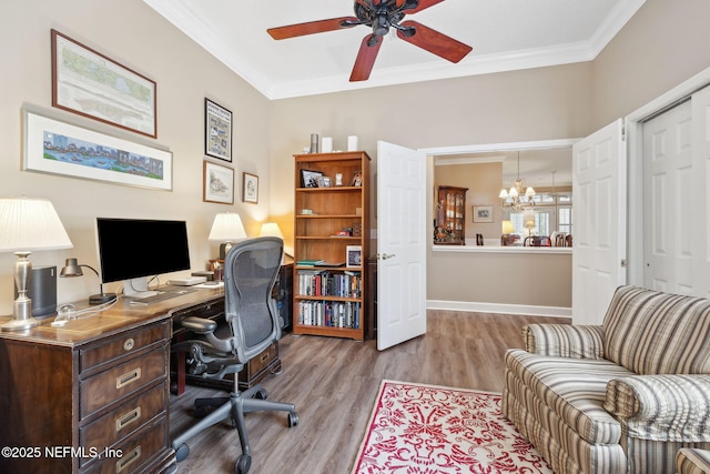 home office with ceiling fan with notable chandelier, baseboards, wood finished floors, and crown molding