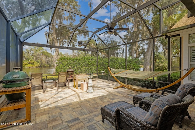 view of patio with a lanai and a grill