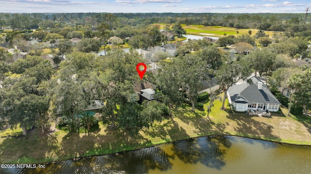 birds eye view of property with a water view