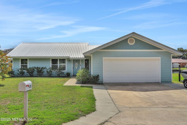ranch-style house with metal roof, concrete driveway, an attached garage, and a front yard