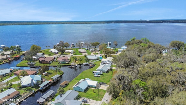 birds eye view of property featuring a residential view and a water view