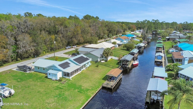 bird's eye view featuring a water view and a residential view
