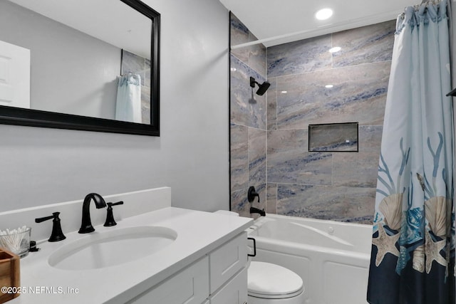 bathroom featuring shower / bath combination with curtain, vanity, and toilet