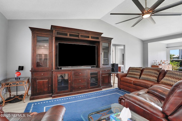 living room with lofted ceiling, baseboards, a ceiling fan, and wood finished floors