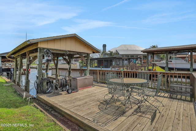 wooden terrace featuring a dock and boat lift