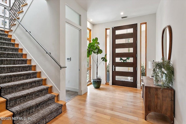 2446 Seminole Rd, Atlantic Beach, FL 32233 - foyer featuring light wood-style flooring, recessed lighting, visible vents, baseboards, and stairway
