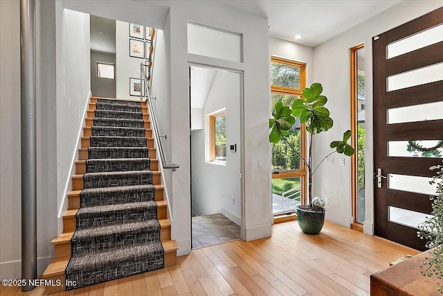 2446 Seminole Rd, Atlantic Beach, FL 32233 - entryway featuring recessed lighting, baseboards, stairway, and hardwood / wood-style floors