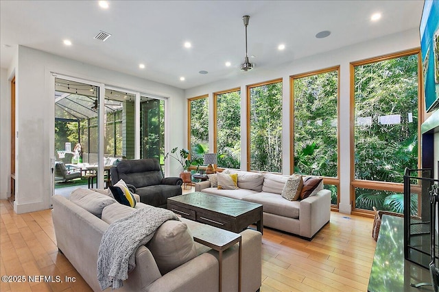2446 Seminole Rd, Atlantic Beach, FL 32233 - living room with a sunroom, visible vents, light wood-style floors, and recessed lighting