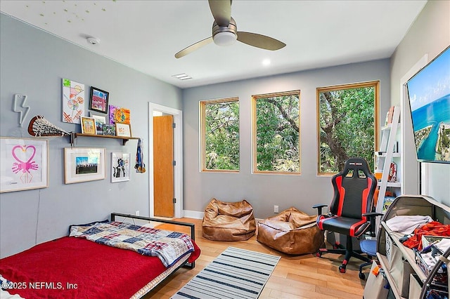 2446 Seminole Rd, Atlantic Beach, FL 32233 - bedroom with ceiling fan, multiple windows, visible vents, and wood finished floors
