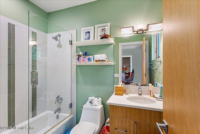 2446 Seminole Rd, Atlantic Beach, FL 32233 - bathroom with enclosed tub / shower combo, vanity, and toilet