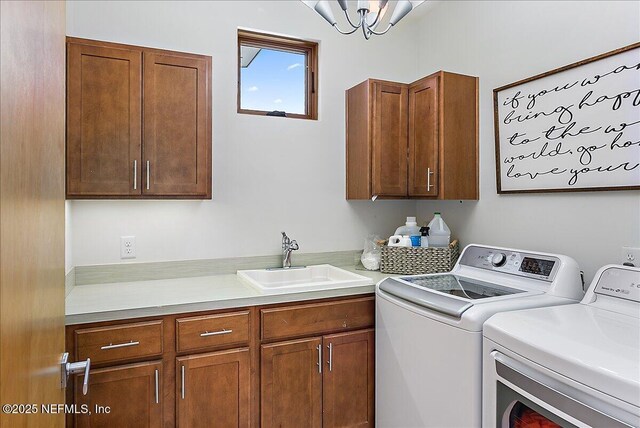 2446 Seminole Rd, Atlantic Beach, FL 32233 - clothes washing area featuring separate washer and dryer, a sink, and cabinet space