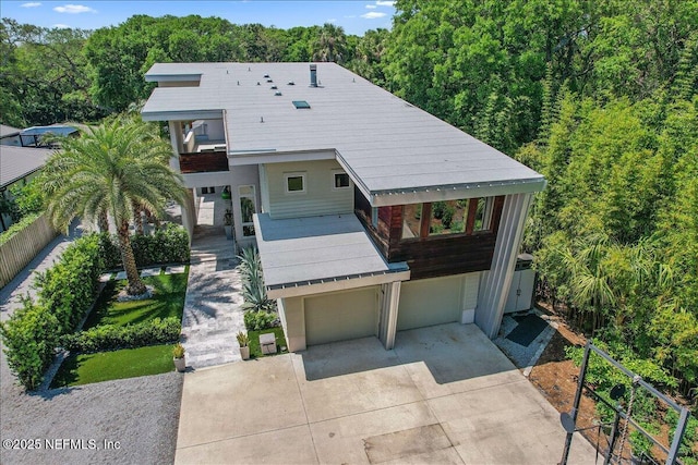 2446 Seminole Rd, Atlantic Beach, FL 32233 - view of front of property featuring concrete driveway, an attached garage, and a balcony