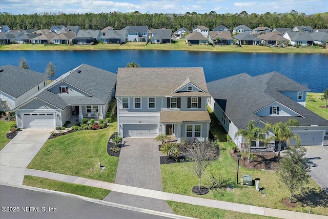 bird's eye view featuring a residential view and a water view