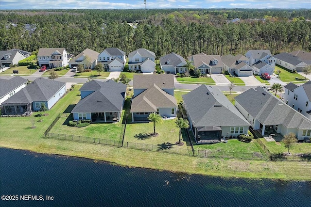 bird's eye view with a residential view and a water view