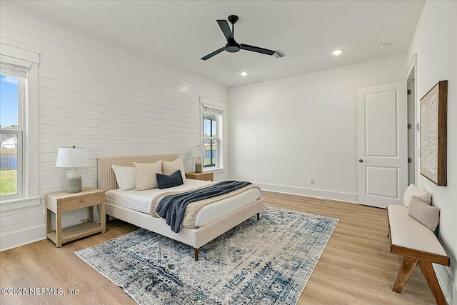 bedroom featuring a ceiling fan, light wood-style flooring, recessed lighting, and baseboards