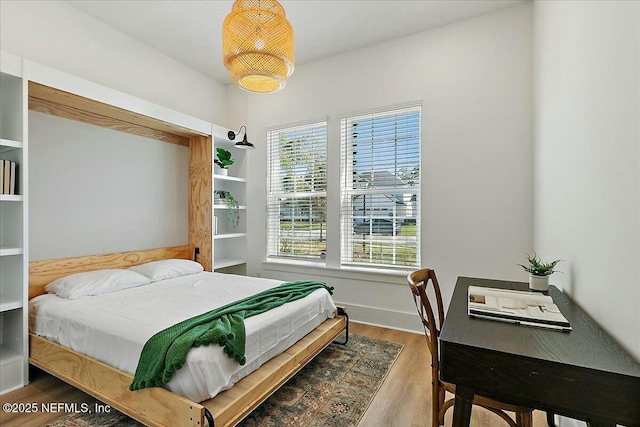 bedroom with wood finished floors