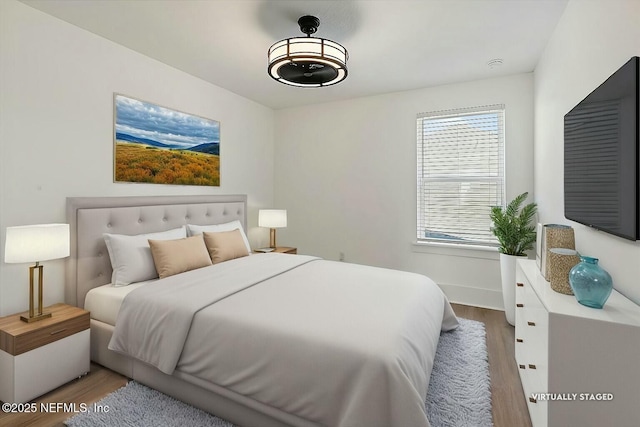 bedroom featuring wood finished floors