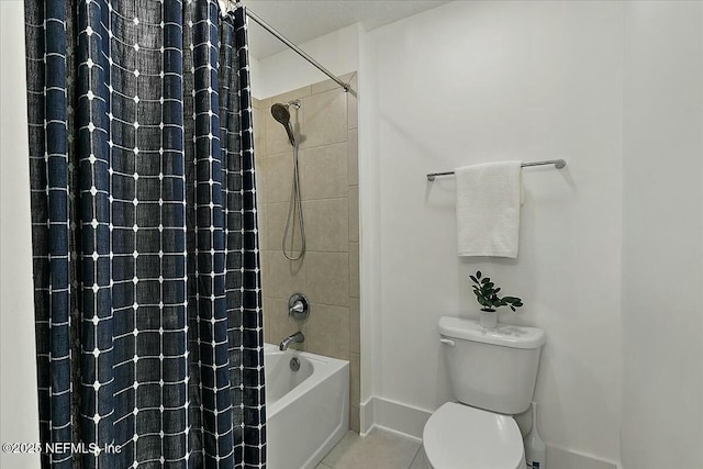 full bath featuring tile patterned floors, toilet, shower / bath combo, and baseboards