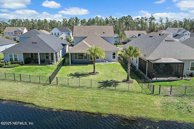 aerial view with a residential view and a water view