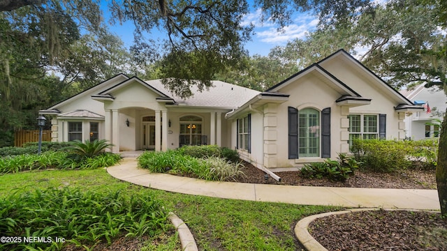 single story home featuring stucco siding