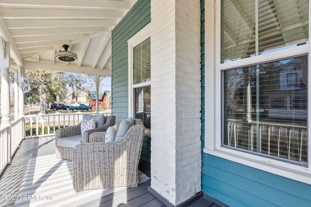 wooden terrace with a porch