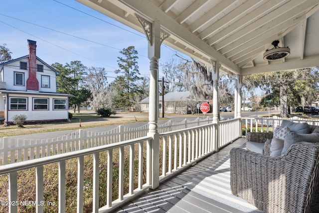 wooden terrace featuring a porch