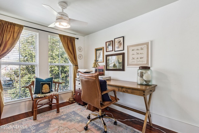 office featuring ceiling fan, baseboards, and wood finished floors