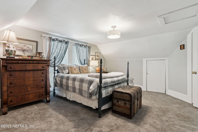carpeted bedroom with lofted ceiling, attic access, and baseboards
