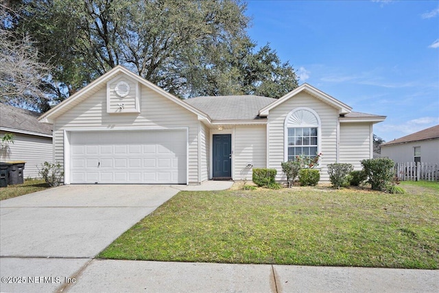 ranch-style home with a garage, a front yard, and concrete driveway