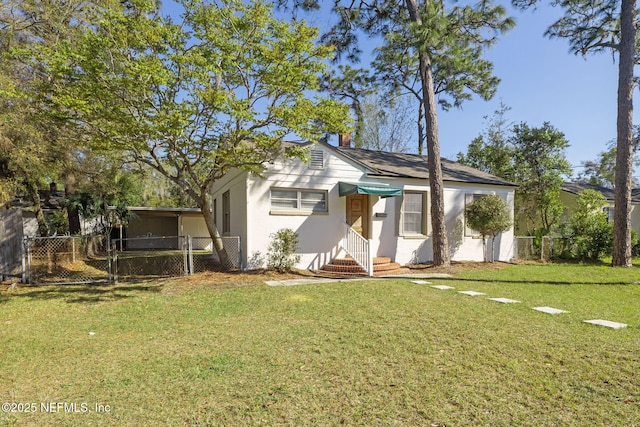 view of front of home with fence, entry steps, a front yard, stucco siding, and a gate