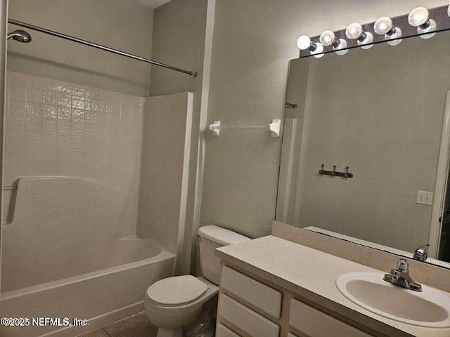 full bath featuring toilet, tile patterned flooring, bathtub / shower combination, and vanity