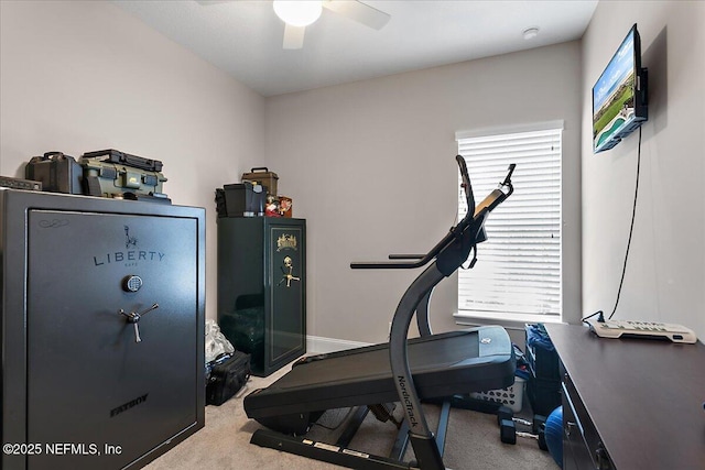 workout area with light carpet, ceiling fan, and baseboards