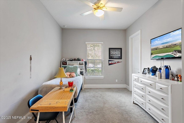 bedroom with baseboards, ceiling fan, and light colored carpet