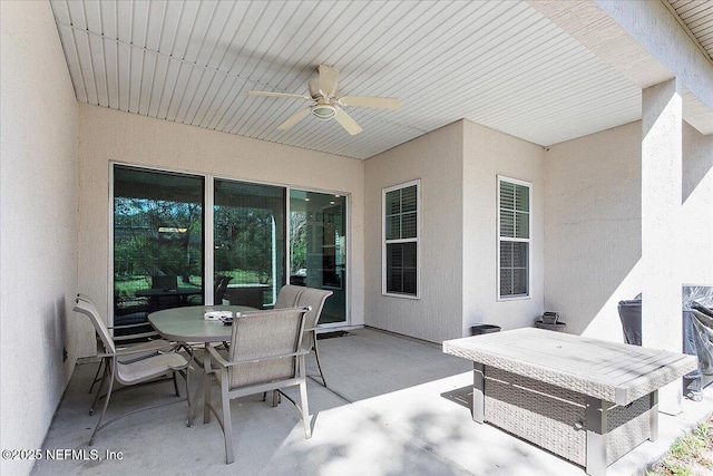 view of patio / terrace featuring a ceiling fan and outdoor dining area