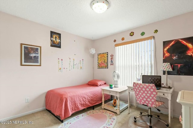 bedroom with a textured ceiling, baseboards, and carpet flooring