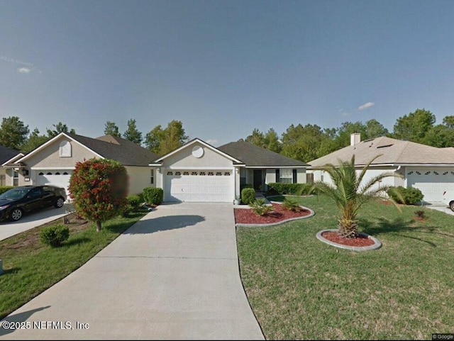 ranch-style home with a garage, concrete driveway, and a front yard