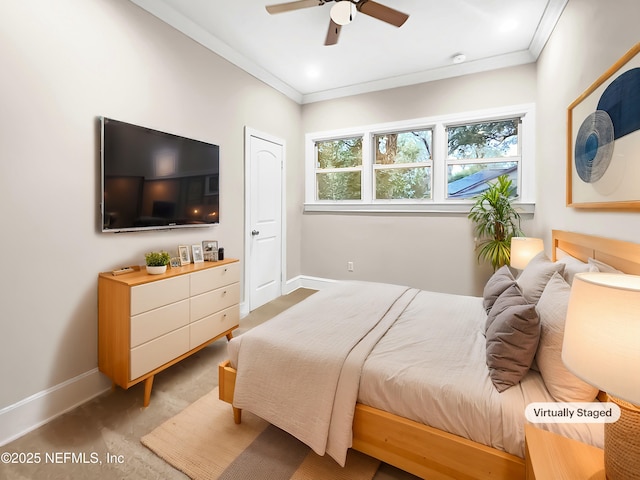 bedroom with ceiling fan, carpet floors, ornamental molding, and baseboards