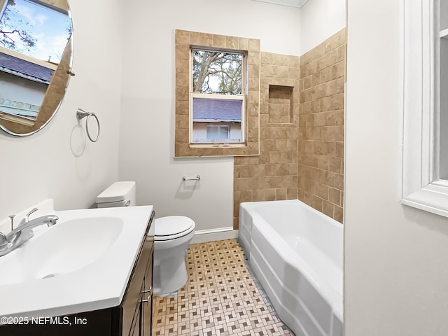 full bathroom with baseboards, vanity, and toilet