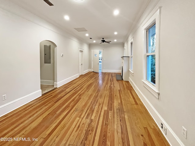 spare room featuring light wood-type flooring, baseboards, a ceiling fan, and recessed lighting