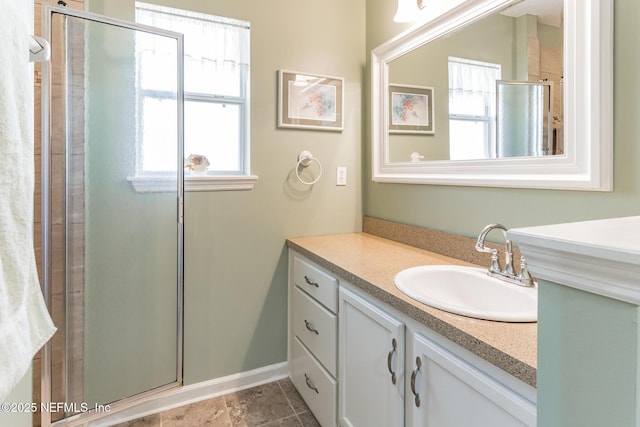 full bathroom featuring a stall shower and vanity