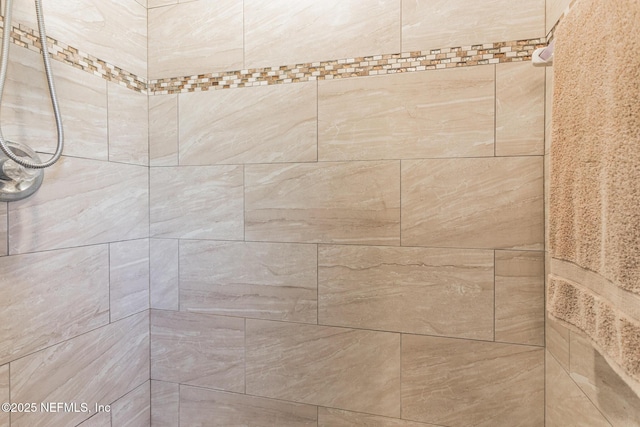 details featuring a tile shower