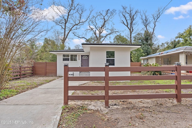 view of gate featuring a fenced front yard