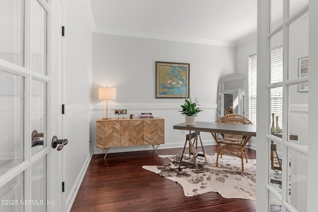 home office featuring ornamental molding, arched walkways, dark wood-style flooring, and french doors