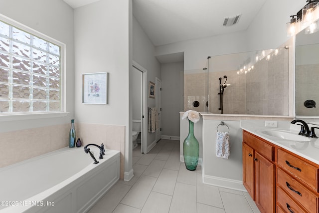 full bath with visible vents, toilet, a garden tub, tile patterned flooring, and vanity