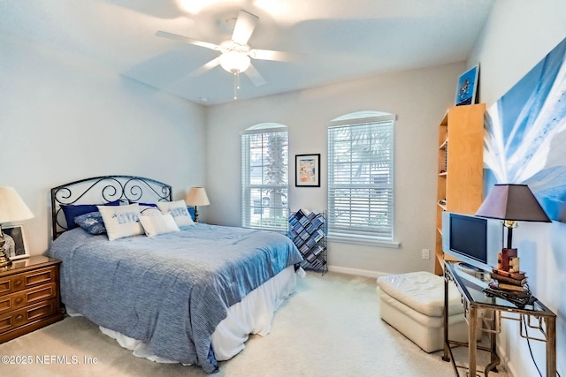 bedroom featuring ceiling fan, baseboards, and carpet floors