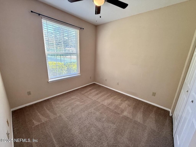 unfurnished bedroom with carpet floors, baseboards, and a ceiling fan