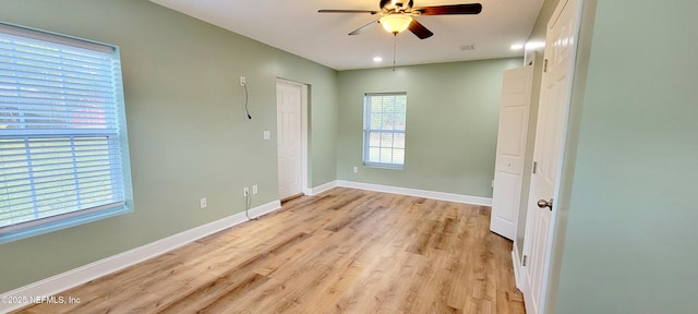 spare room featuring visible vents, baseboards, recessed lighting, light wood-style floors, and a ceiling fan